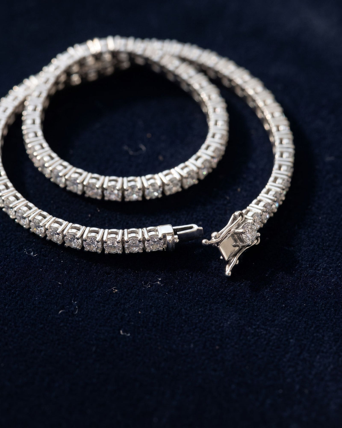 Moissanite tennis bracelet on navy velvet